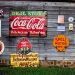 Werbung als Blogger - drug store drink coca cola signage on gray wooden wall