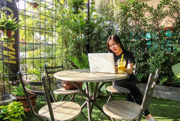 The Pros and Cons of Remote Work - woman sitting on chair while using laptop